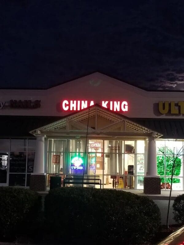 A building with the word china king lit up.