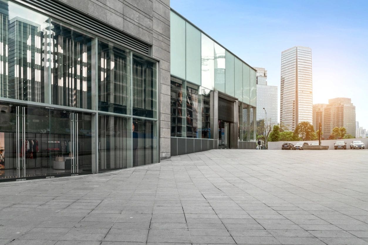 A large building with many windows and glass.