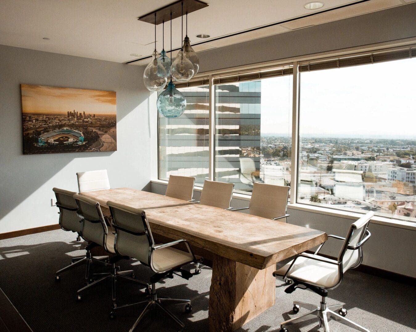 A large conference room with a view of the city.