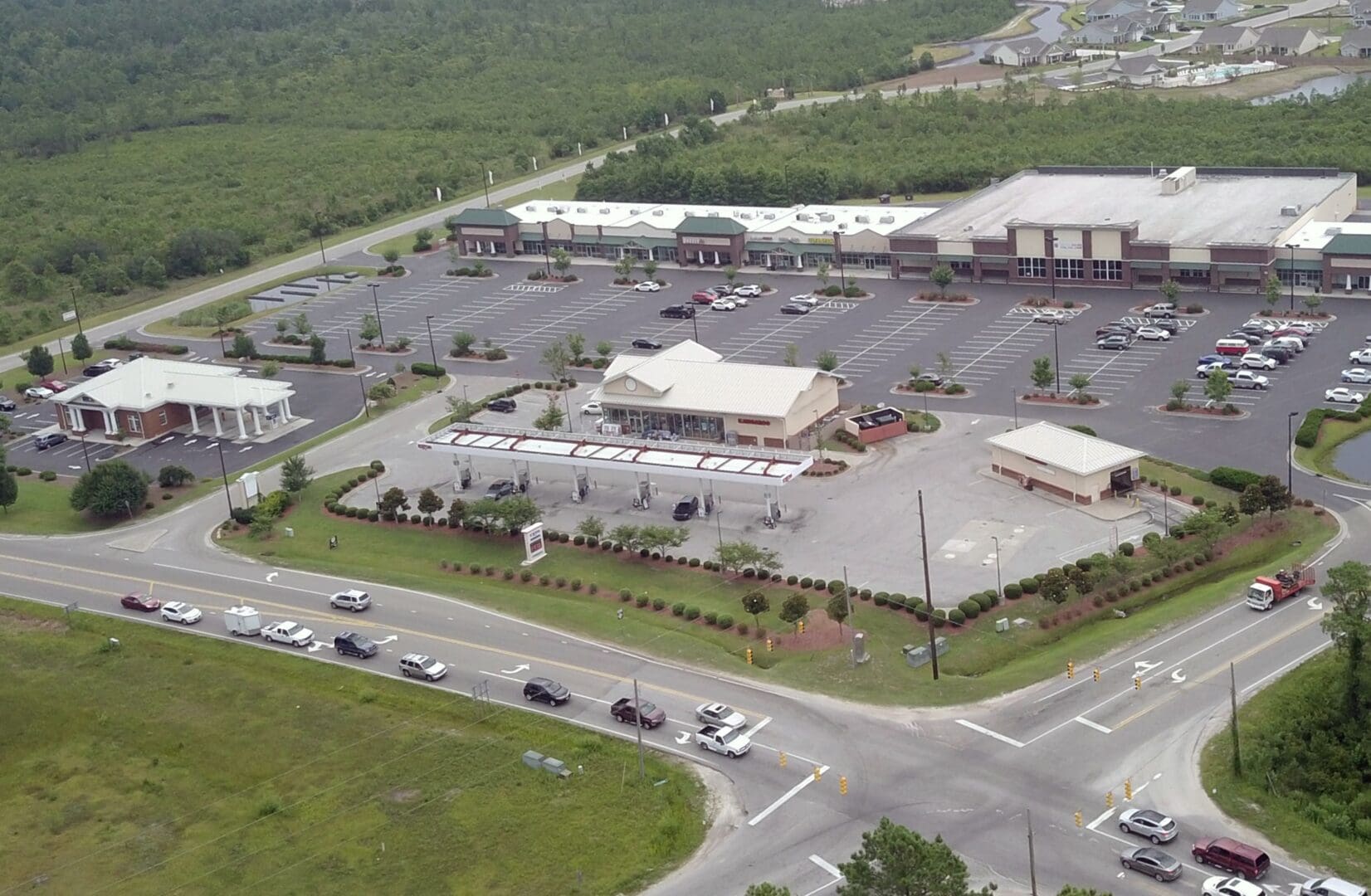 DCIM100MEDIADJI_0017.JPG An aerial view of a parking lot with many cars parked in it.